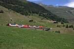 Der Glacier-Express wird als langsamster Schnellzug der Welt bezeichnet. Heutzutage wird er mit modernen Panoramawagen f�r touristische Zwecke betrieben.
Hier f�hrt am 05.07.2026 eine Komposition Richtung St. Moritz, aufgenommen bei Rueras.