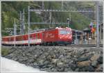 HGe 4/4 mit Regionalzug aus Brig f�hrt aus T�sch aus Richtung Zermatt.