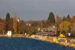 218 452-1 463-8 und em EuroCity EC 194 bei der Einfahrt auf dem Bahndamm Lindau.