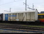 SBB - Güterwagen Gbs 23 85 2 311 700-6 im Bahnhof von Balsthal am 25.12.2022