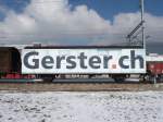 SBB - Gterwagen mit Werbung Gbs 21 85 150 0844-7 abgestellt in einem Industriegeleise in Egerkingen am 21.02.2009