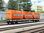 SBB - Gterwagen Typ Slps-x  33 85 472 7 197-7 im Bahnhof Spiez am 01.07.2011