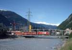 MGB exFO GLACIE-EXPRESS 900 von Brig nach Disentis am 23.05.1993 auf der Rhonebrcke in Brig mit E-Lok HGe 4/4II 105 - RhB B 2370 - RhB B 2423 - A 2063 - BVZ AB 2142 - ABt 4158.