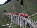 MGB exFO GLACIE-EXPRESS B 902 von Zermatt nach Chur am 28.05.1992 auf Bugnei-Viadukt mit E-Lok HGe 4/4II 106 - B - BVZ B - RhB B - A.