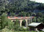 MGB exFO 1.Klasse-PANORAMA-GLACIE-EXPRESS B 902 von Zermatt nach St.Moritz am 24.05.1997 auf Grengiols-Viadukt mit E-Lok HGe 4/4II 107 - RhB WR 3811 - AS 4023 - BVZ AS 2011- AS 4027 - AS 4022.
