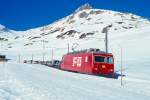 MGB FO-AUTOTRANSPORTZUG 4346 Von Andermatt nach Sedrun am 14.02.1998 kurz nach Oberalppasshhe-Galerie mit Zahnrad-E-Lok HGe 4/4II 108 - 6x Rw - RhB B 2213.