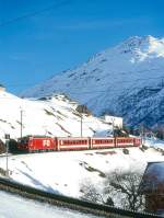 MGB FO-REGIONALZUG 351 von Disentis nach Andermatt am 15.02.1998 Einfahrt Andermatt mit Zahnrad-E-Lok HGe 4/4II 103 - B 4285 - B 4287 - AB 4171 - RhB B 2260 - B 4269 - D 4343.