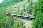 MGB BVZ GTERZUG 2171 von Brig nach Zermatt am 23.05.1997 in der Tschwang-Galerie mit Zahnrad-Doppeltriebwagen ABDeh 8/8 2041 - Haiktv 2704 - Gak 2464 - Gb 2421 - Sbx 2762 - Sbk 2752.