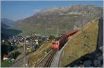 Die MGB HGe 4/4 II 108 ist mit ihrem Regionalzug 819 von Disentis kommend schon bald am Ziel ihrer Fahrt nach Andermatt, welches bereits zu erkennen ist.