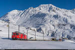 MGB Deh 4/4 24  Täsch  mit Autozug Andermatt - Sedrun am 10. Januar 2021 unterhalb Nätschen.
