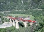 MGB exFO 1.Klasse-PANORAMA-GLACIE-EXPRESS B 902 von Zermatt nach St.Moritz am 23.05.1993 auf Grengiols-Viadukt mit E-Lok HGe 4/4II 103 - RhB WR 3811 - BVZ AS - RhB A - AS. Hinweis: Dies war der 1. Plantag
