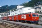 MGB FO-REGIONALZUG 12 von Brig nach Disentis am 06.06.1993 in Disentis mit Zahnrad-E-Lok HGe 4/4II 106 - D 4343 - RhB B 2245 - ABt 4194. Hinweis: FO-Fahrzeuge in alter Lackierung, Bahnhofsanlagen vor Umbau.
