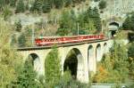 MGB FO-REGIONALZUG 260 von Brig nach Andermatt am 11.10.1996 auf Rhone-Viadukt bei Grengiols mit Zahnrad-Triebwagen Deh 4/4I 54  - B 4277 - B 4254 - ABt 4154. Hinweis: FO-Fahrzeuge noch in alter Lackierung.
