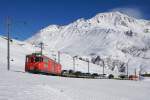 Deh 4/4 I 24 mit einem Autozug am 21.02.2016 zwischen Andermatt und Nätschen.