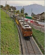  La DER de la Saison 2023  - Die Bernina Bahn RhB Ge 4/4 81 der Blonay-Chamby Bahn mit dem  Velours -Express von Chaulin nach Vevey bei Cornaux unmittelbar vor der Einfahrt in den  Baye de Clarens Schlucht  Tunnel. 

29. Okt. 2023