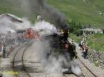 Am 23.06.2007 fuhr die Dampflok Fo4 um 14.50 Uhr  mit geladenen Gsten zur Station Furka.Ausfahrt  Realp im Hintergrund steht der Dieseltraktor Tmh 985.