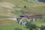 Am 05.07.2026 erreicht der Jubil�umszug von Disentis bald Realp. Bis Andermatt wurde er vom Elektrooldtimer FO 36 gezogen. Hier auf der Br�cke �ber die Furkareuss.