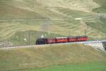 Am 05.07.2026 erreicht der Jubil�umszug von Disentis bald Realp. Bis Andermatt wurde er vom Elektrooldtimer FO 36 gezogen. Hier auf der Br�cke �ber die Furkareuss.
