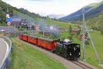 DFB (Original BFD) H 3/4 Nr. 9 fährt während den Festivitäten zur 100 Jahre Feier Brig-Gletsch auf ebendieser Strecke und bis Rehalp. Sie hat mit den DFB-Wagen soeben den Bahnhof Niederwald verlassen und fährt in Richtung Fiesch und Brig. Aufnahme vom 14. Aug. 2014, 17:54