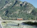 FM Dampfextrazug fr GRAUBNDEN TOURS V3215 von Cama nach Castione-Arbedo vom 29.08.1997 auf der Moesabrcke bei Roveredo mit Dampflok G 3/4 1 - B 21 - B 2060 - A 1102.