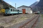 SEFT Nachschau 2014,Blick auf das Depot der Ferrovia Mesolcinese(1995-2013)in Grono mit div.abgestellten Fahrzeugen. Vorne links die beiden Personenwagen B51 u.52 ex.BM C52/RhB B2012 von 1907.Es gibt Pläne hier ein kleines Bahnmuseum zu errichten!? In der Halle stehen noch die anderen Fahrzeuge der FM. 
Grono 29.03.14