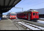 AB / RHB - Einfahrender Zahnradtriebzug BDeh 3/6  25 neben dem abgestellten Zahnradtriebwagen ABDeh 2/4 23 im Bahnhof von Heiden am 21.01.2024