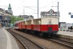 Alt und Neu: Der moderne BDeh 3/6 25 der Rorschach-Heiden-Bergbahn steht am 23.04.11 im Bahnhof Rorschach Hafen bereit, um den Velo-Wagen und drei historische, offene Wagen nach Heiden zu befrdern.