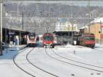 SBB / CJ 1435 mm  - Im Bahnhof Porrentruy der Triebzug RABe 522 207 und der CJ Triebwagen RBDe 4/4 560 141-2 sowie einem SBB NPZ Steuerwagen ..