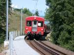 Rorschach-Heiden-Bergbahn RHB (13.07.2003)  Ein bergwrts fahrender Zug erreicht die Haltestelle Wartensee.