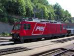 Eine Lokomotive der Appenzellerbahnen ( AB ) steht mit einem Gterzug im Bahnhof Herisau.