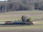 asm BTI - Kieszug mit Be 4/4 523 und 3 Kieswagen Typ Fa und Be 4/4 101 unterwegs bei Siselen am 21.02.2010