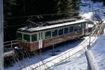 Der Triebwagen Be 4/4 22 am 28.1.24 kurz vor der Einfahrt in Grütschalp.