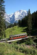 BLM Be 4/4 22 berquert soeben die Staubbachbrcke zwischen Winteregg und Grtschalp. Im Hintergrund das Jungfraujoch und die Jungfrau.(18.08.2012)