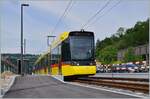Gelbe Züge: der neue Waldenburgerbahn WB Be 6/8 101 auf Testfahrt wartet auf den neu verlegten Meterspurgeleisen in Bubendorf Bad auf die Weiterfahrt.