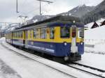 BOB - Triebwagen ABeh 4/4 306 vor Regio bei der einfahrt in den Bahnhof von Grindelwald am 25.02.2011