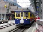 BOB - Triebwagen ABeh 4/4 308 vor Regio bei der einfahrt in den Bahnhof von Lauterbrunnen am 25.02.2011