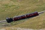 Die Heizl befeuerte Lok BRB 15 fhrt am 01.10.2011 hinauf zum Brienzer Rothorn, hier kurz vor der Schnegg Galerie.