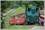 Lok 12 ist auf der Planalp angekommen. Im Hintergrund sieht man die weiterfhrende Strecke Richtung Brienzer Rothorn. (03.08.2012)