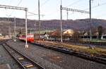 CJ Bf Glovelier__Be 4/4 Tw 617 (ex Frauenfeld-Wiel-Bahn) aus den 80er Jahren als aktuelle 'Zuglok' mit etlichen leeren Rollschemeln.__27-02-2026