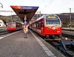 CJ Bf Glovelier__Alt-Tw 616 Be 4/4 neben aktuellem Tw-Zug nach La Chaux-de-Fonds [Tw 651; Be 4/4 Stadler].__27-02-2026