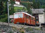 Gtertriebwagen 3062 mit Gterwagen in Zermatt.