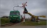 Der Zuckerrübenzug ist platziert, die Fahrleitung geerdet und der Verlad auf freier Strecke kann beginnen.
Bei Mauraz, den 15. Oktober 2014