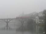 BD/WM - Regio mit dem Triebwagen  BDe 8/8 8 unterwegs nach Bremgarten West auf der Brcke ber die Reuss in Bremgarten/AG bei unfreuntlichem Nebelwetter am 20.11.2009