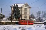 Wagen Nr.6 der Schweizer Privatbahn SGA fährt in den Bahnhof Gais ein (12.02.1986)