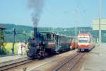 WB Dampfzug 130 von Liestal nach Waldenburg am 09.05.1993 in Bad Bubendorf mit Dampflok G 3/3 5 - B 43 - B 51 - B 48 wird berholt von Regionalzug 30 mit Triebwagen BDe 4/4 13 - Bt 118 - Bt 120.