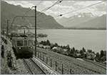 Der MOB ABDe 8/8 4004  Fribourg  unterwegs von Montreux nach Chernex kurz vor Châtelard VD. Im Hintergrund rechts im Bild die  Dents de Midi , übersetzt die  Zähne des Mittags  und somit eine Erklärung weshalb bei diesem um die Mittageszeit aufgenommen Foto nur S/W in Frage kam.
30. Juni 2017  
