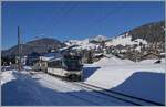 Die MOB Ge 4/4 8002 und am Schluss ein kaum zu sehender  Alpina  sind mit dem Belle �poque Zug auf der Fahrt von Montreux nach Zweisimmen. Das Bild entstand im Bahnhof Rougemont. 

11. Januar 2021