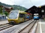 MOB - Triebzug  Nr.4 (ABt 344 + Be 4/4 5004 + Bt 244) neben Triebwagen ABDe 8/8 4002 im Bahnhof von Zweisimmen am 21.07.2012