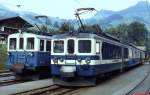 Im Bahnhof Chateau-de Oex überholt ein BDe 4/4 der Reihe 3001-3006 den 1924 gebauten BDe 4/4 28 (Juli 1983)