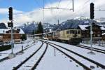 MOB GDe 4/4 6001 mit D 2124  bei Einfahrt in Gstaad, 24.11.2013.